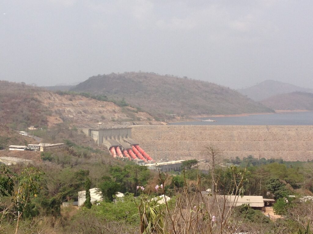 Photo of a rural landscape with dam in the distance.